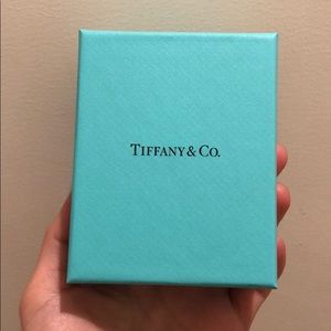 Empty Tiffany and Co boxes with dust bag